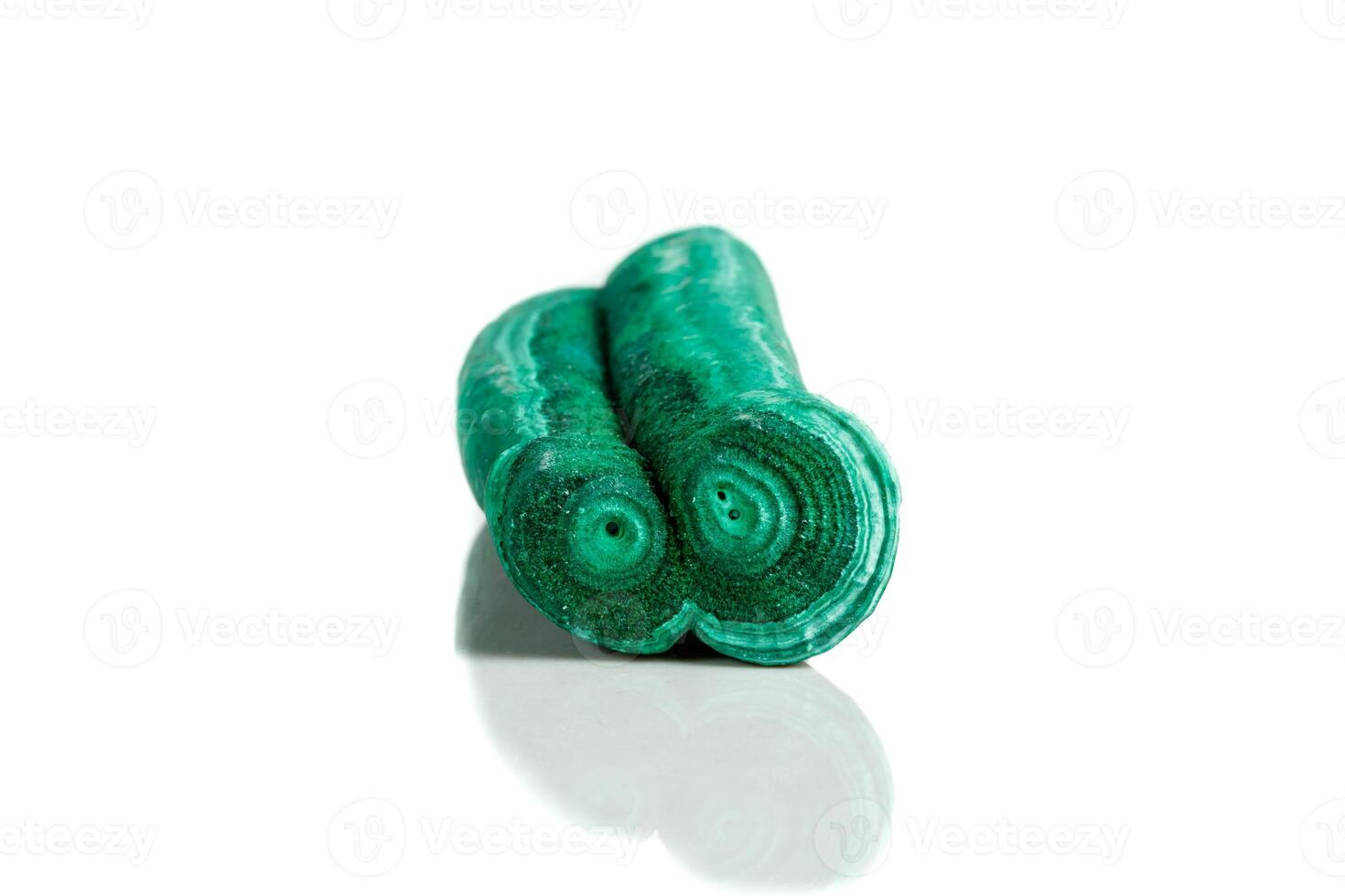 Macro mineral stone malachite stalactite on white background photo