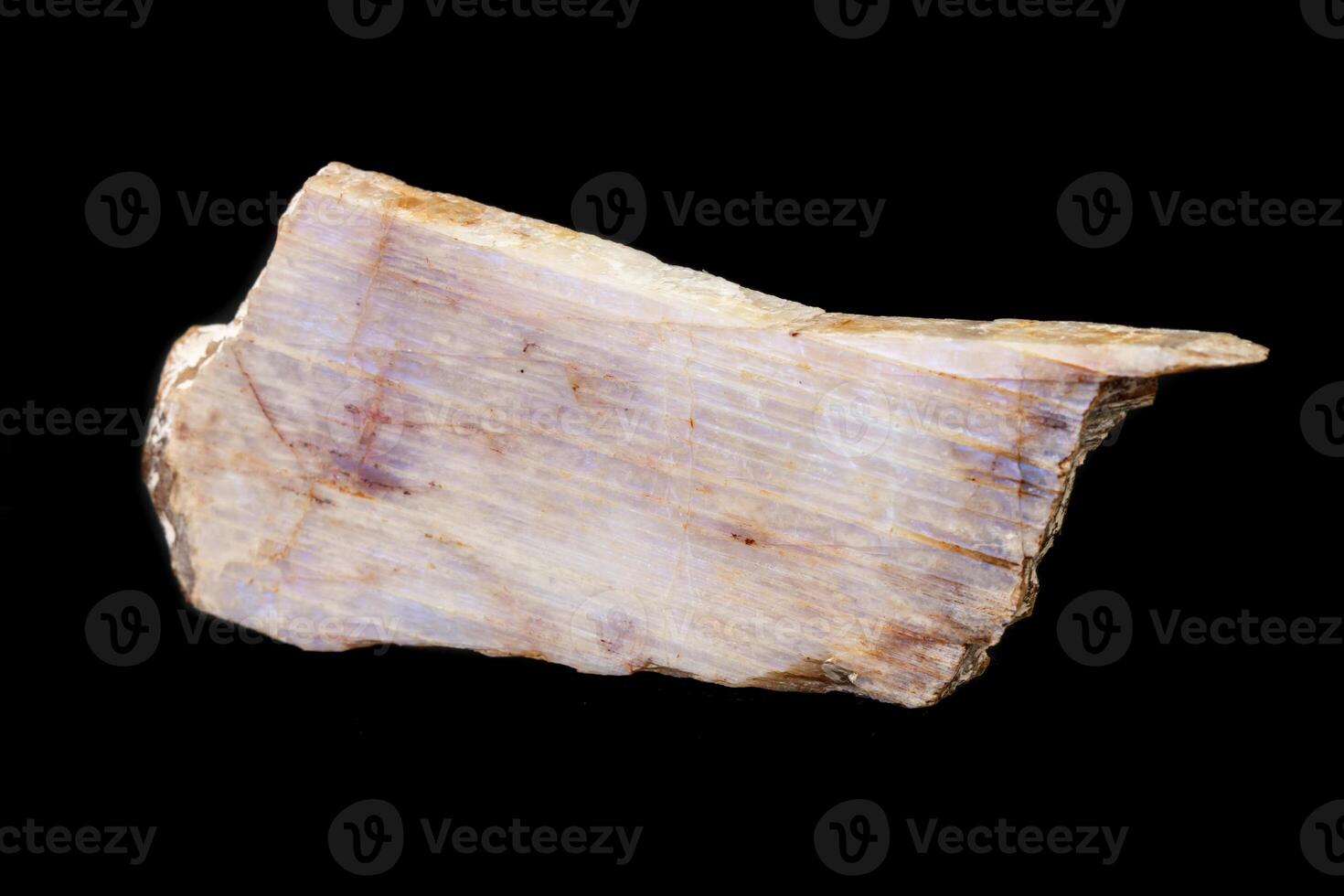 Macro of a stone mineral Moonstone on a black background photo
