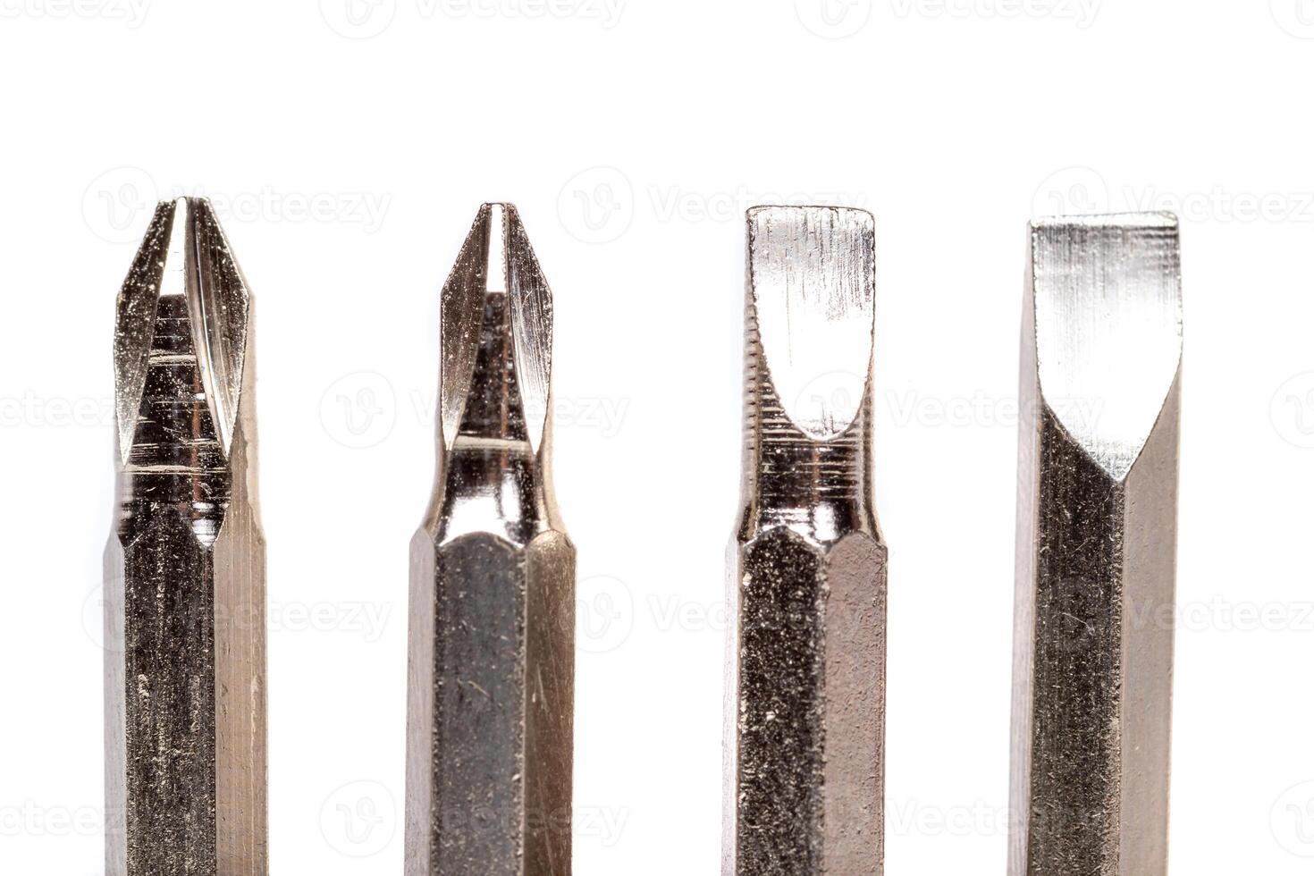 A set of different attachments for a head screwdriver with a screwdriver on a white background photo