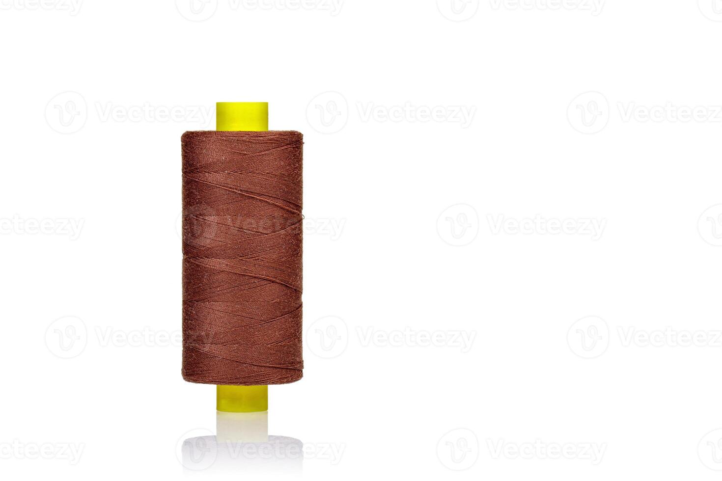 skein of thread brown colors macro on a white background photo