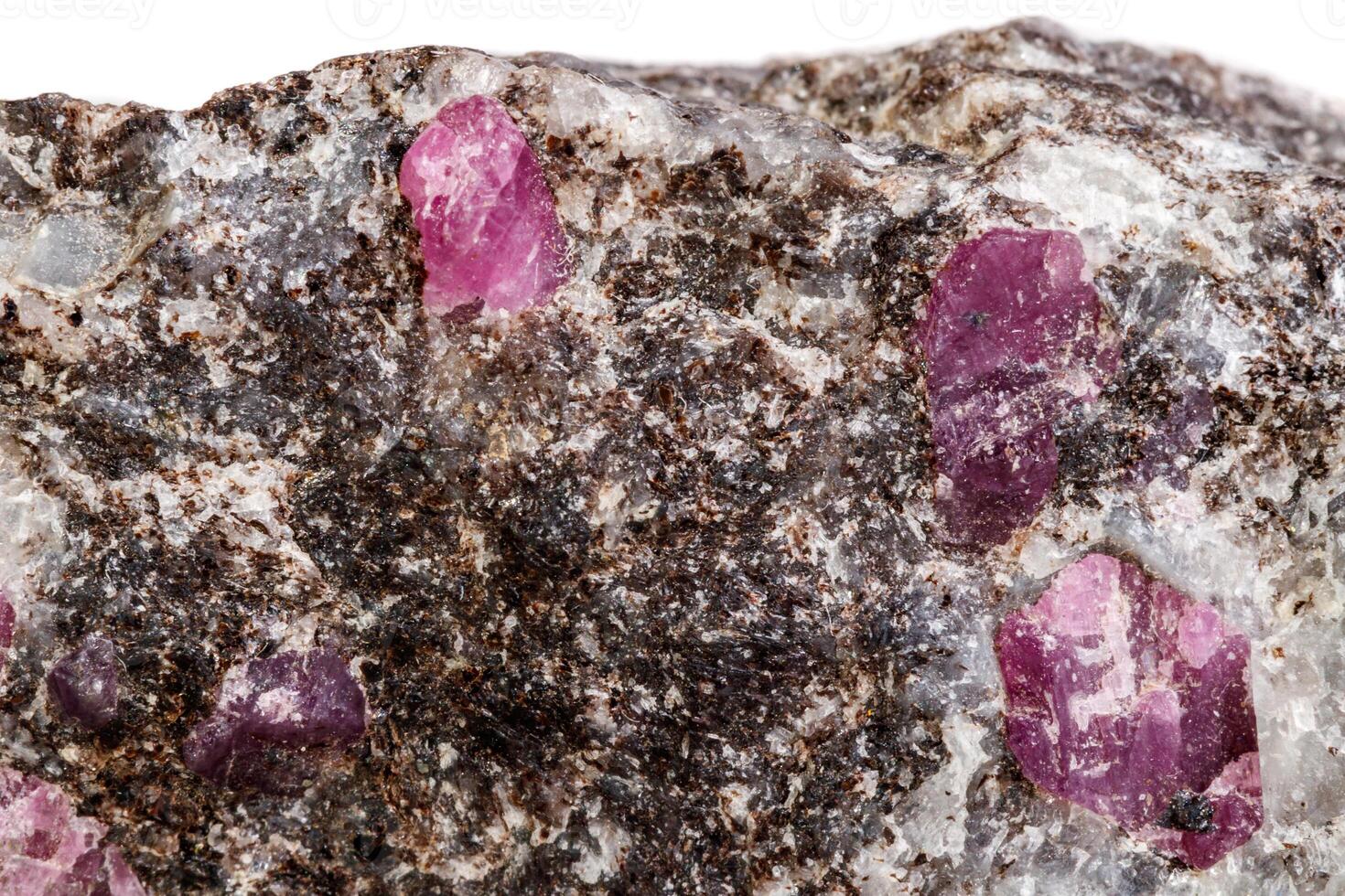 Macro of a mineral Ruby stone on a white background photo