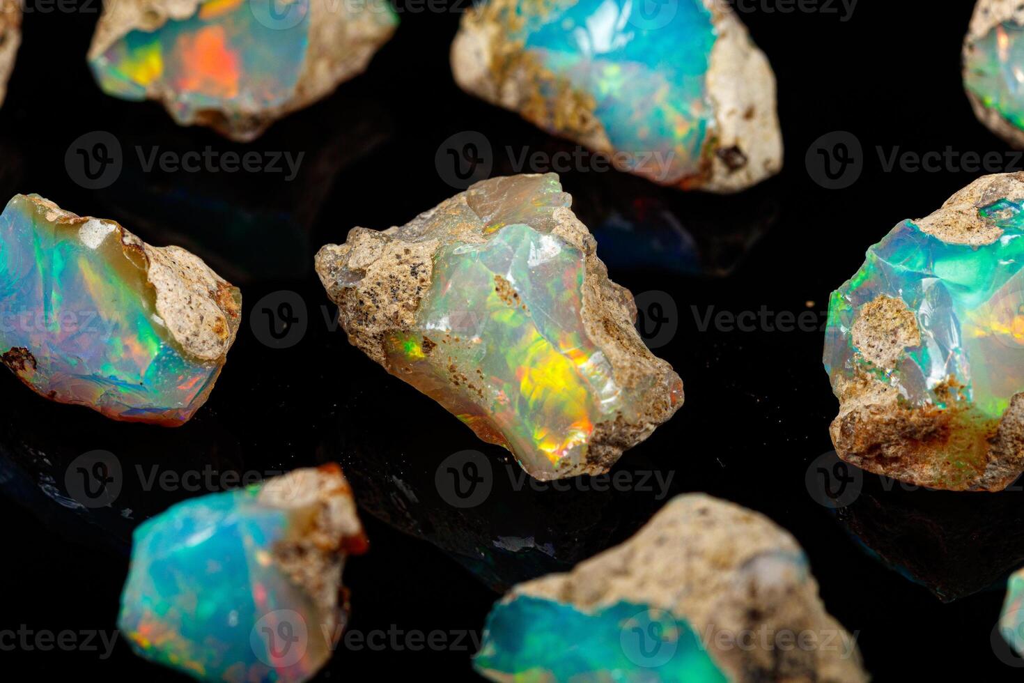 macro mineral stone rare and beautiful opals on a black background photo