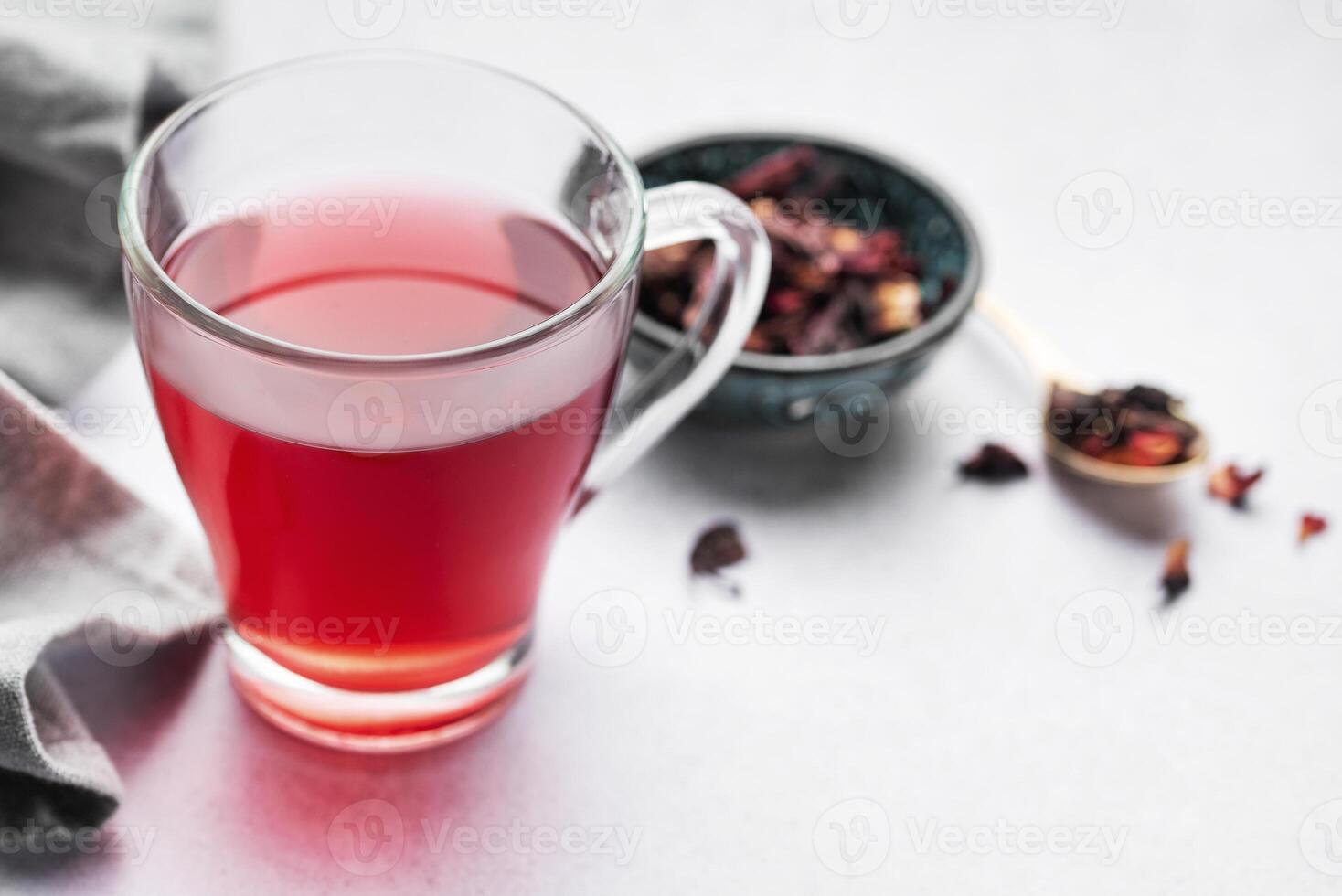 Glass cup of hot hibiscus tea. photo