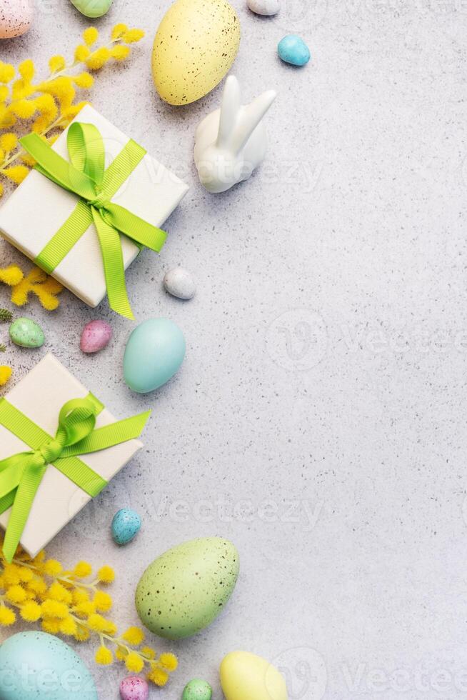 Festive Easter Celebration With Decorated Eggs and Gifts on a Light Background photo