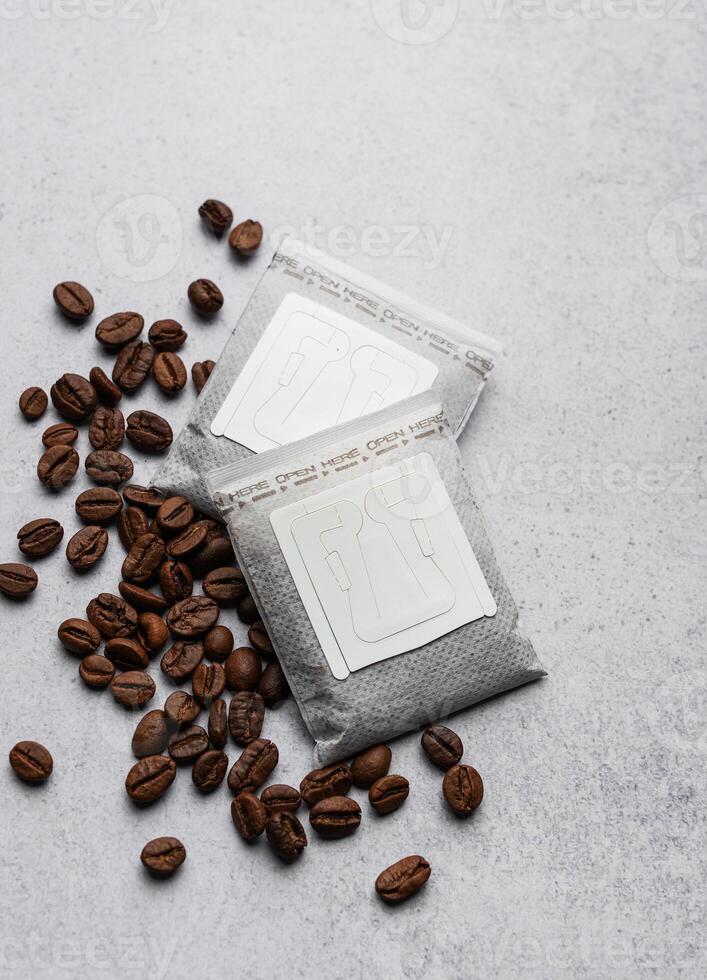 Drip coffee paper bags with coffee beans photo