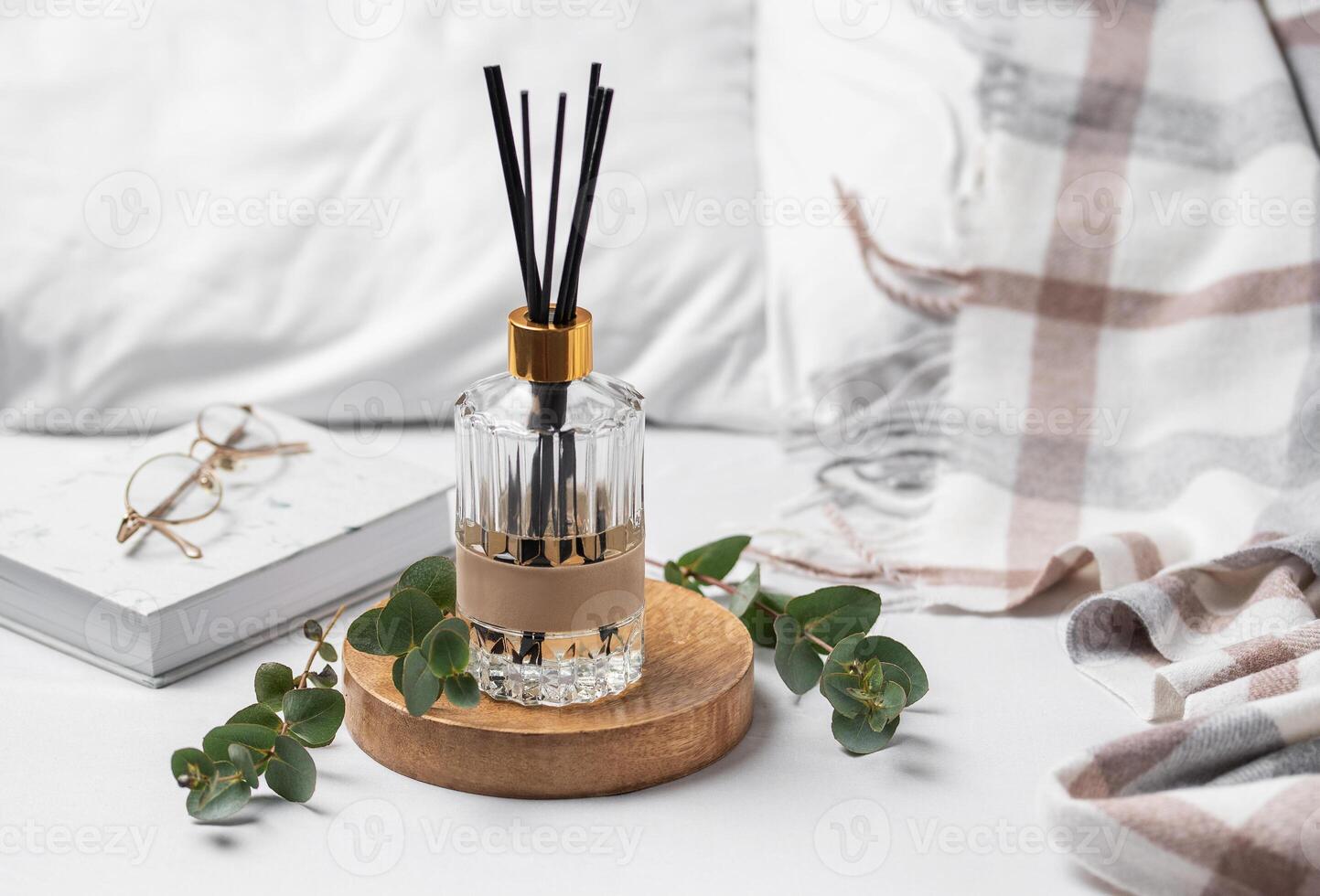 Aromatic reed air freshener, eucalyptus leaves and candle photo