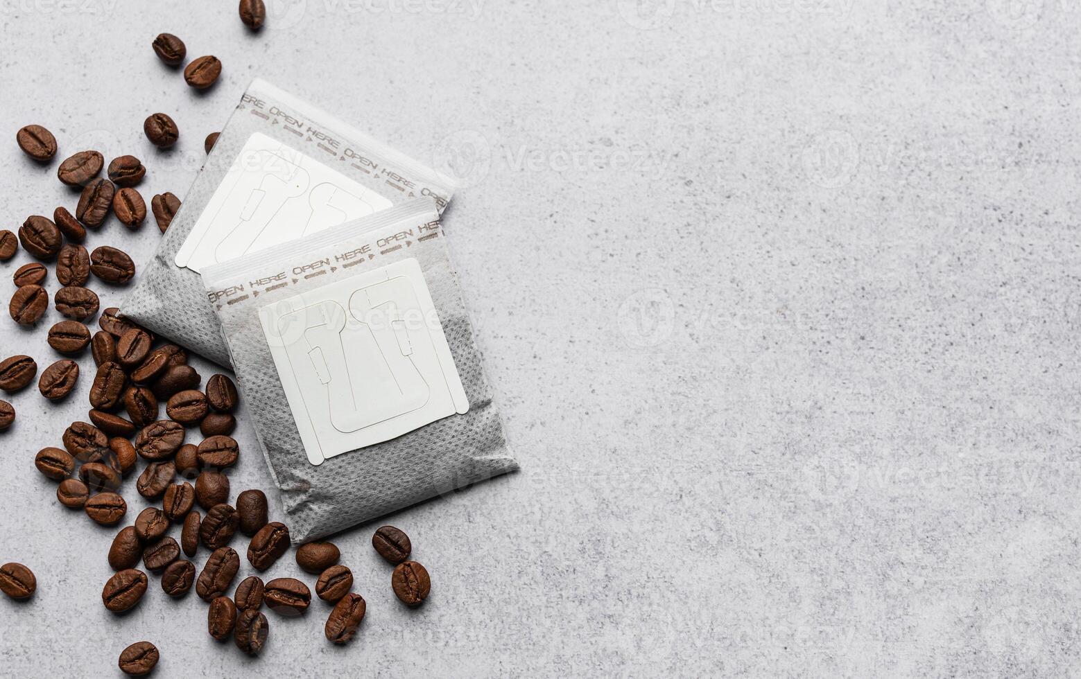 Drip coffee paper bags with coffee beans photo