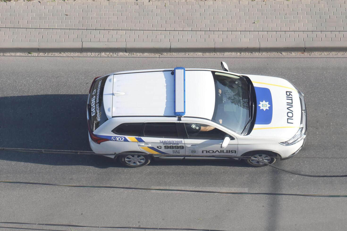 TERNOPIL, UKRAINE - JULY 7, 2023 Ukrainian patrol police white car with police lights and decals in daytime photo