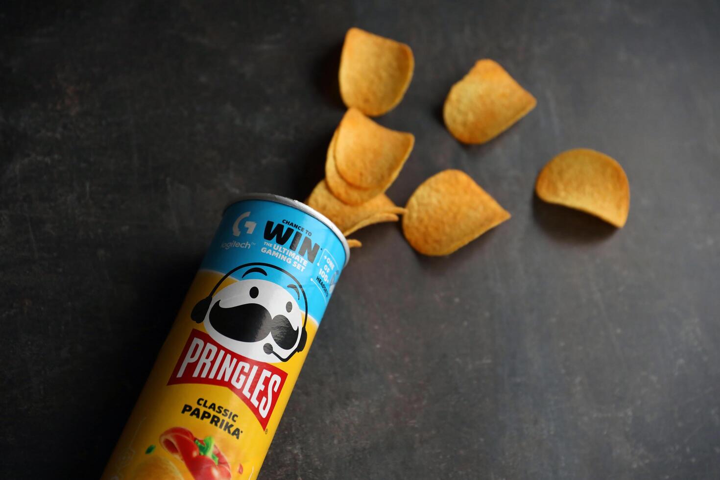 KYIV, UKRAINE - 4 MAY, 2023 Pringles tube of chips with rare classic paprika flavour photo