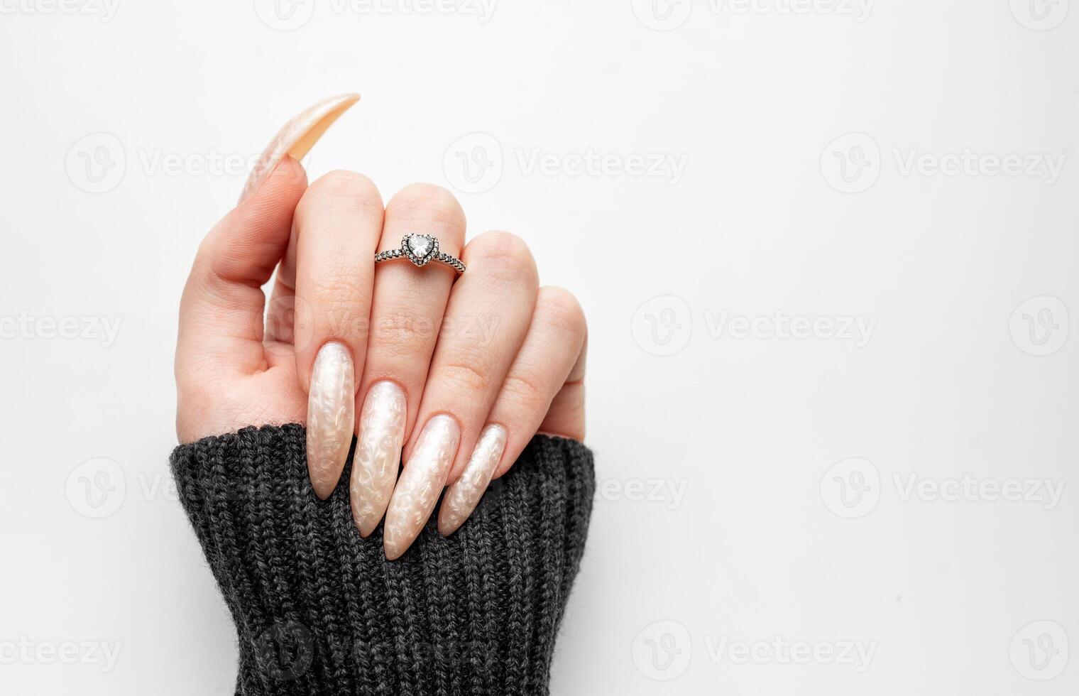 Manicured nails with pearlescent nail polish photo