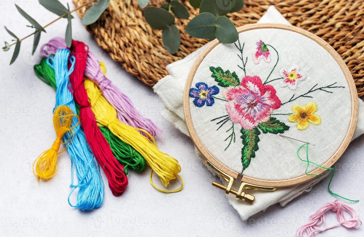 The process of hand embroidering a napkin photo