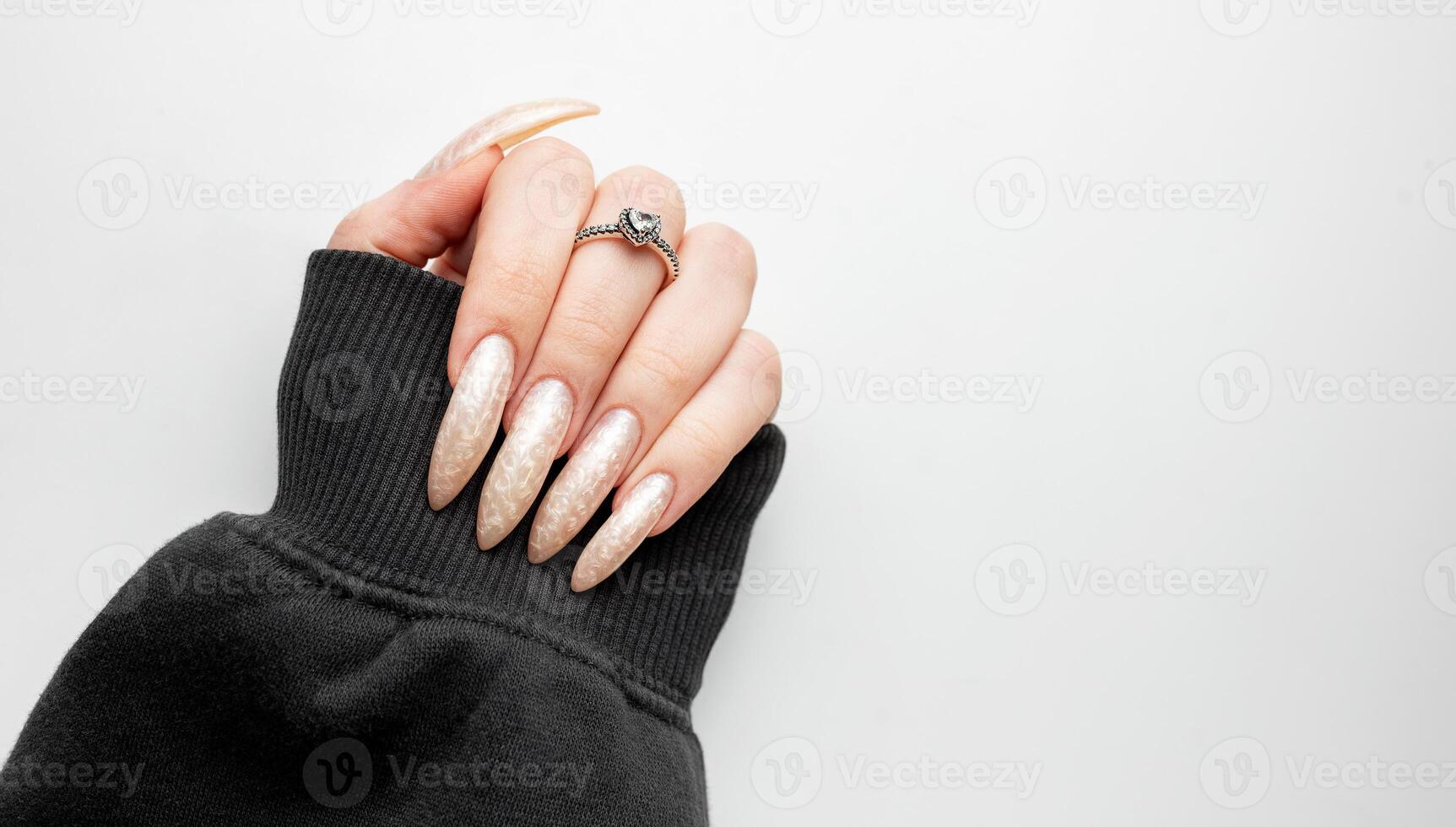 Manicured nails with pearlescent nail polish photo