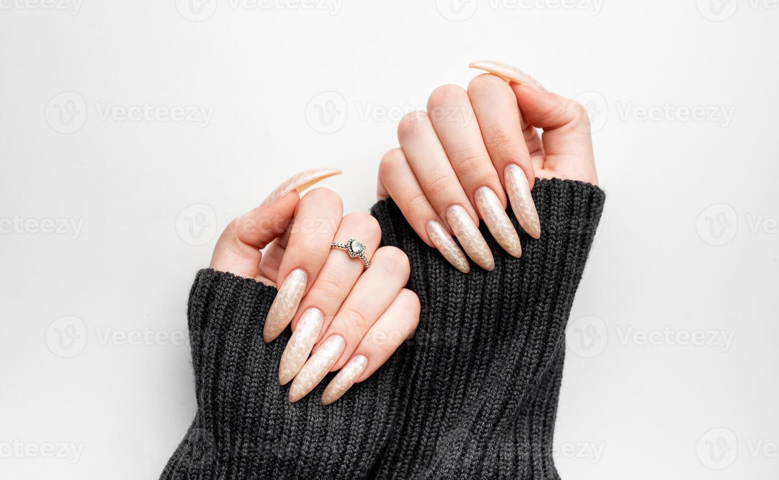 Manicured nails with pearlescent nail polish photo