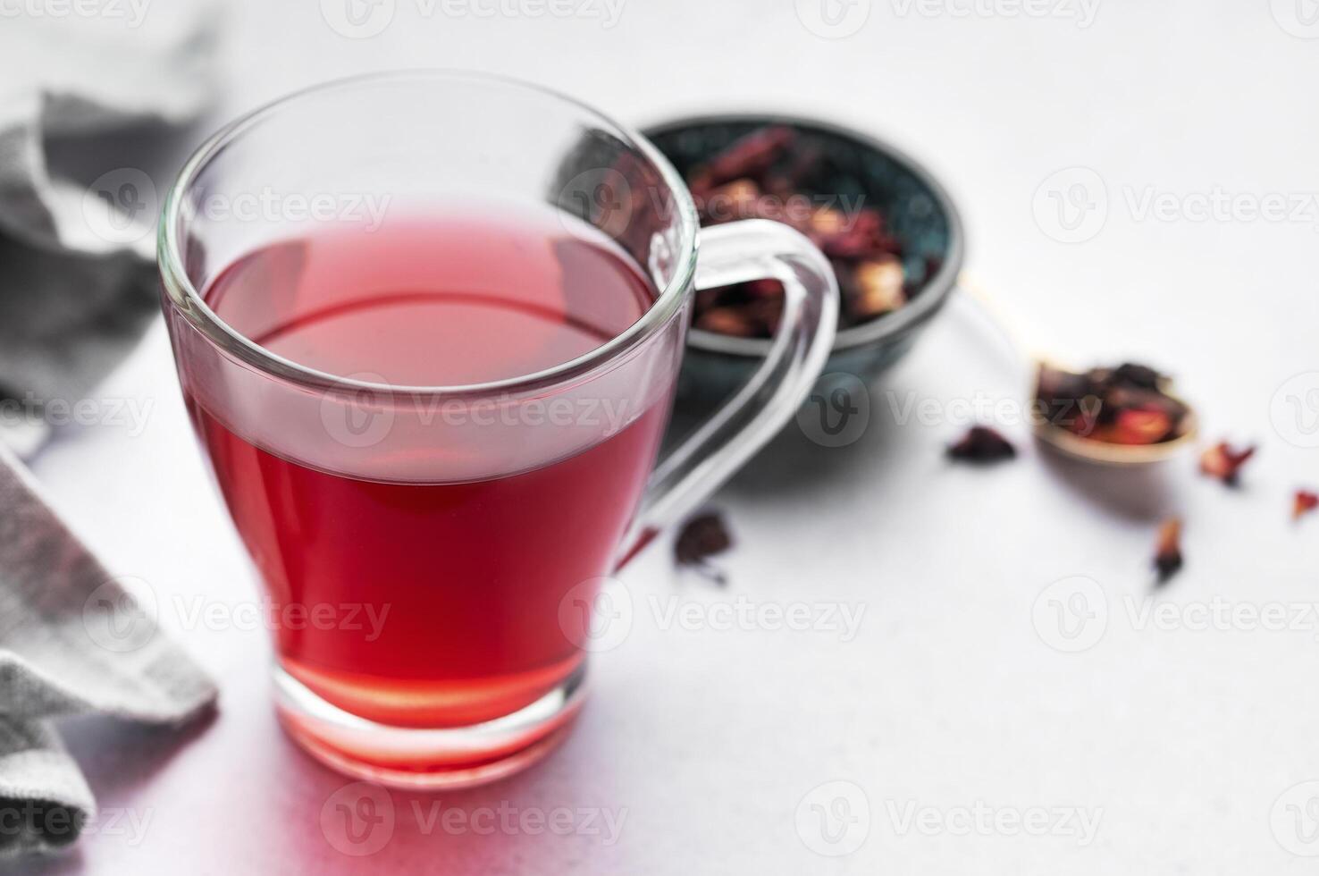 Glass cup of hot hibiscus tea. photo