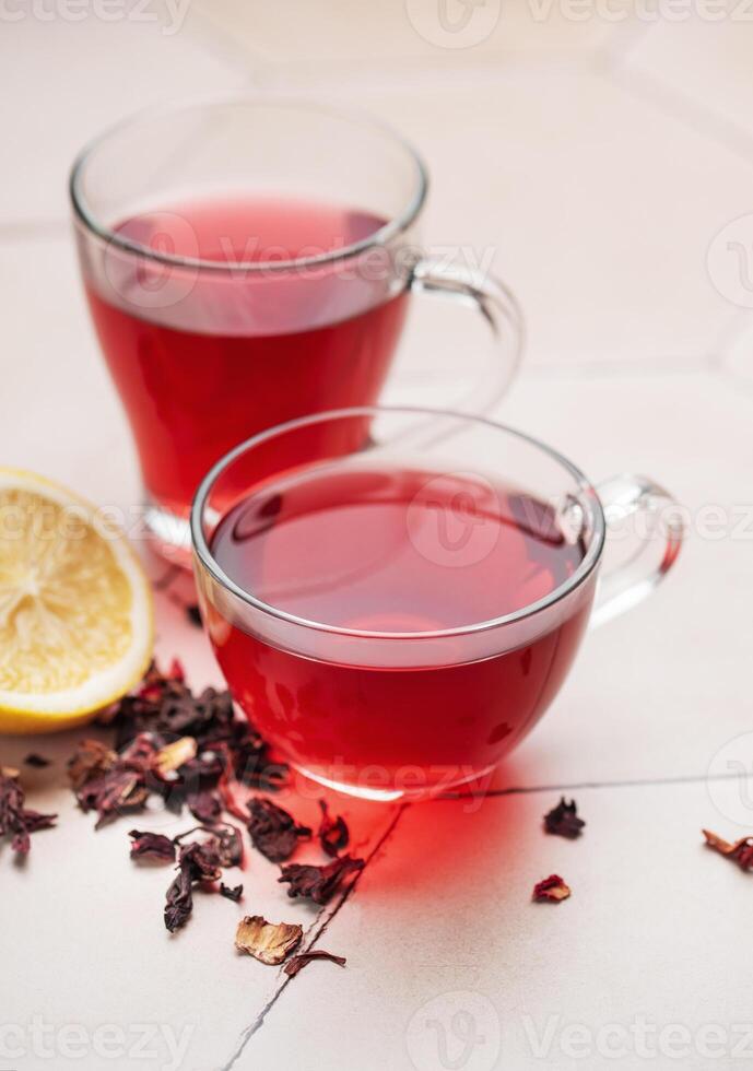 Glass cup of hot hibiscus tea. photo