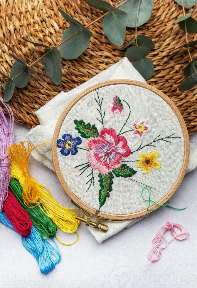 The process of hand embroidering a napkin photo