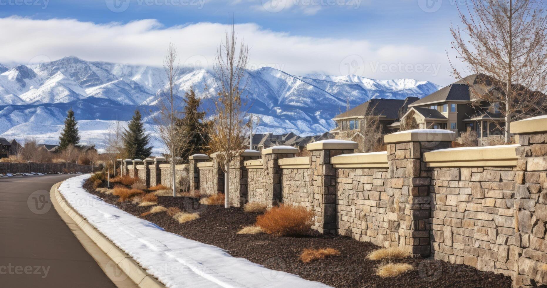 AI generated A Road Lined with a Stone Brick Fence, Offering Views of Snowy Peaks and a Cloudy Sky in a Scenic Neighborhood photo