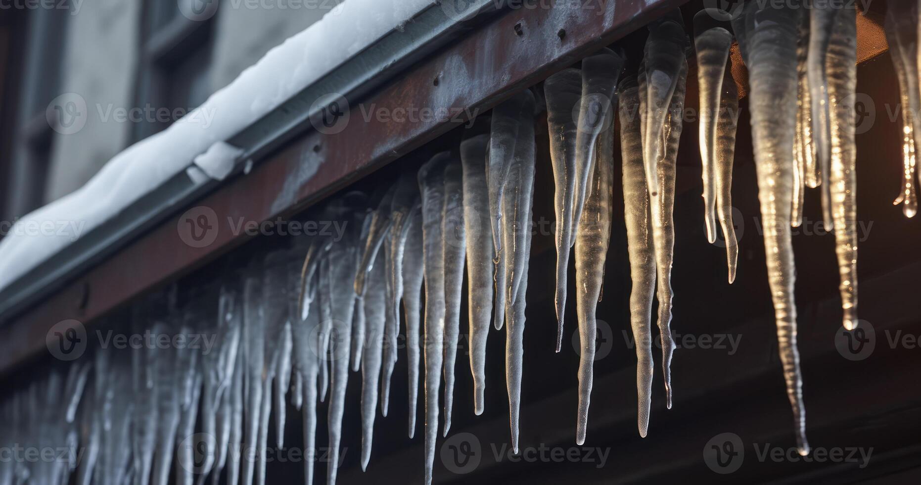 ai generado claveteado carámbanos a el borde de inclinado gris techo con grumos de nieve en invierno foto