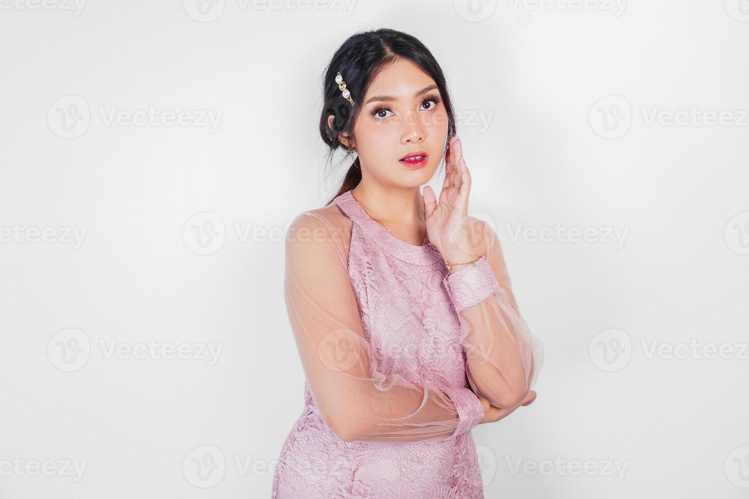Portrait of a young beautiful Asian woman wearing a pink dress, beauty shoot concept photo