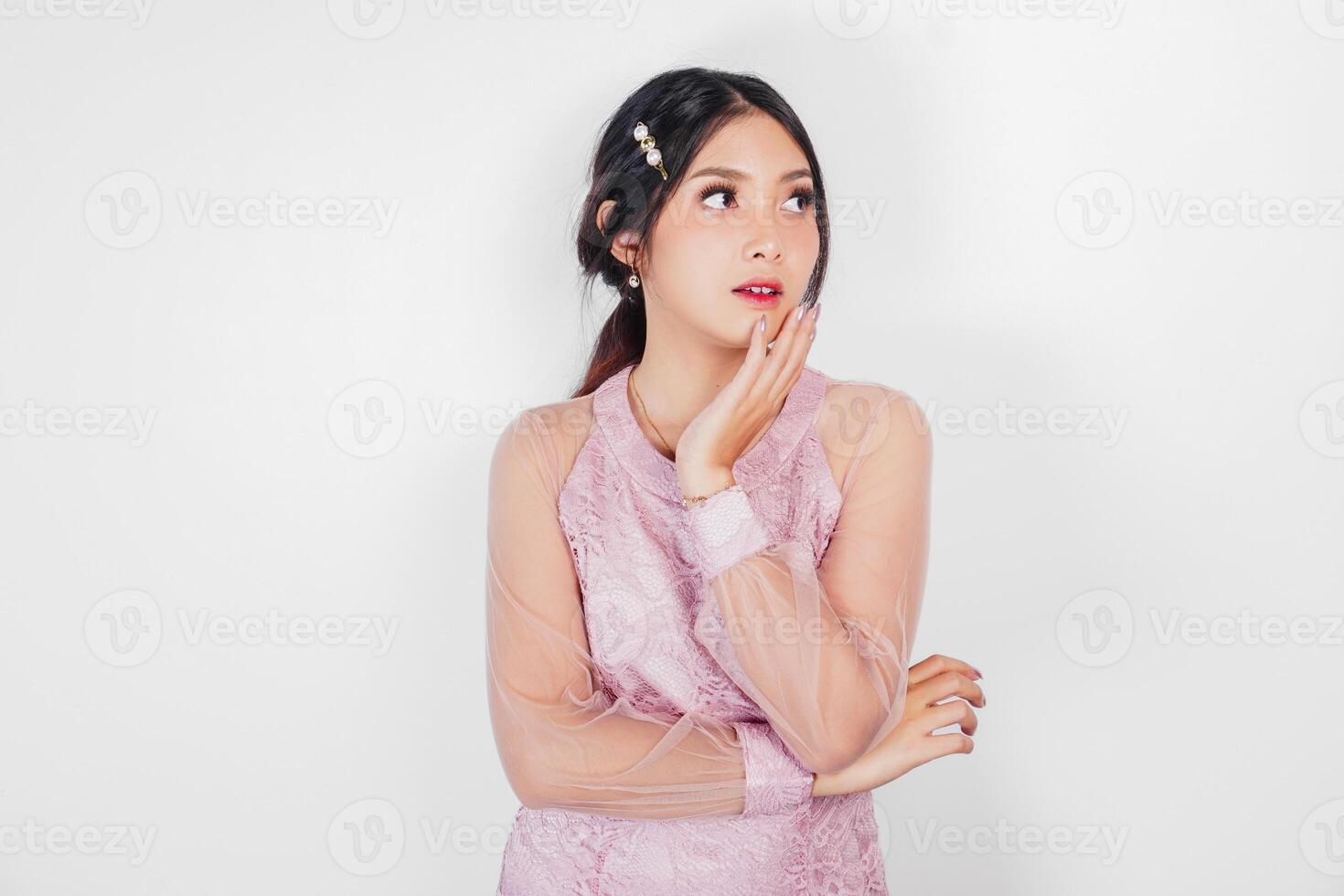 Portrait of a young beautiful Asian woman wearing a pink dress, beauty shoot concept photo