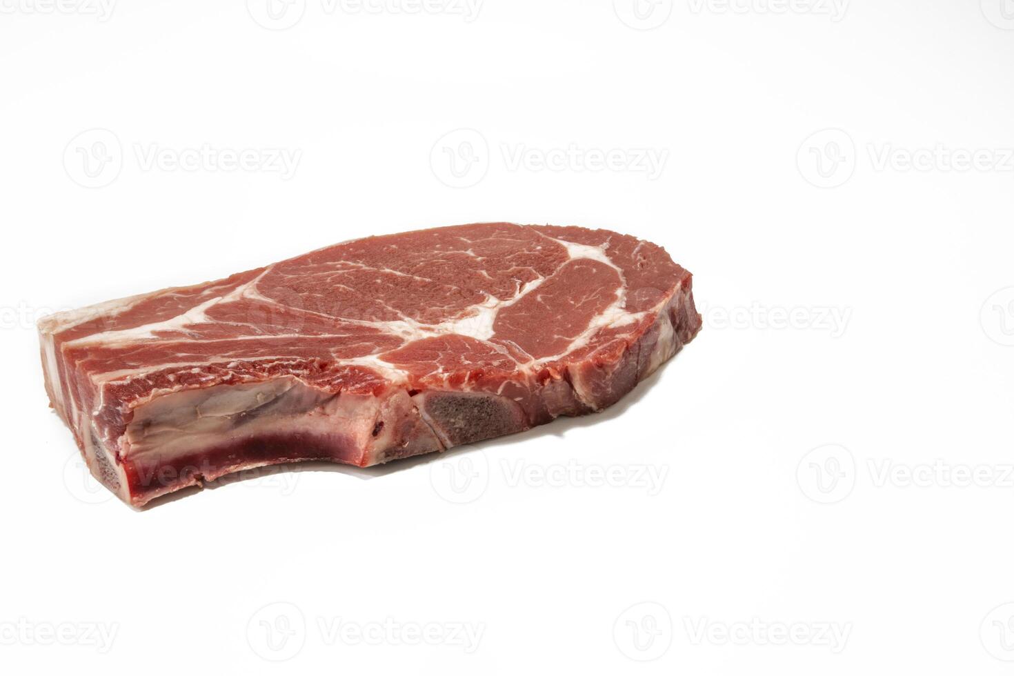 A raw beef steak, isolated on a white background. photo