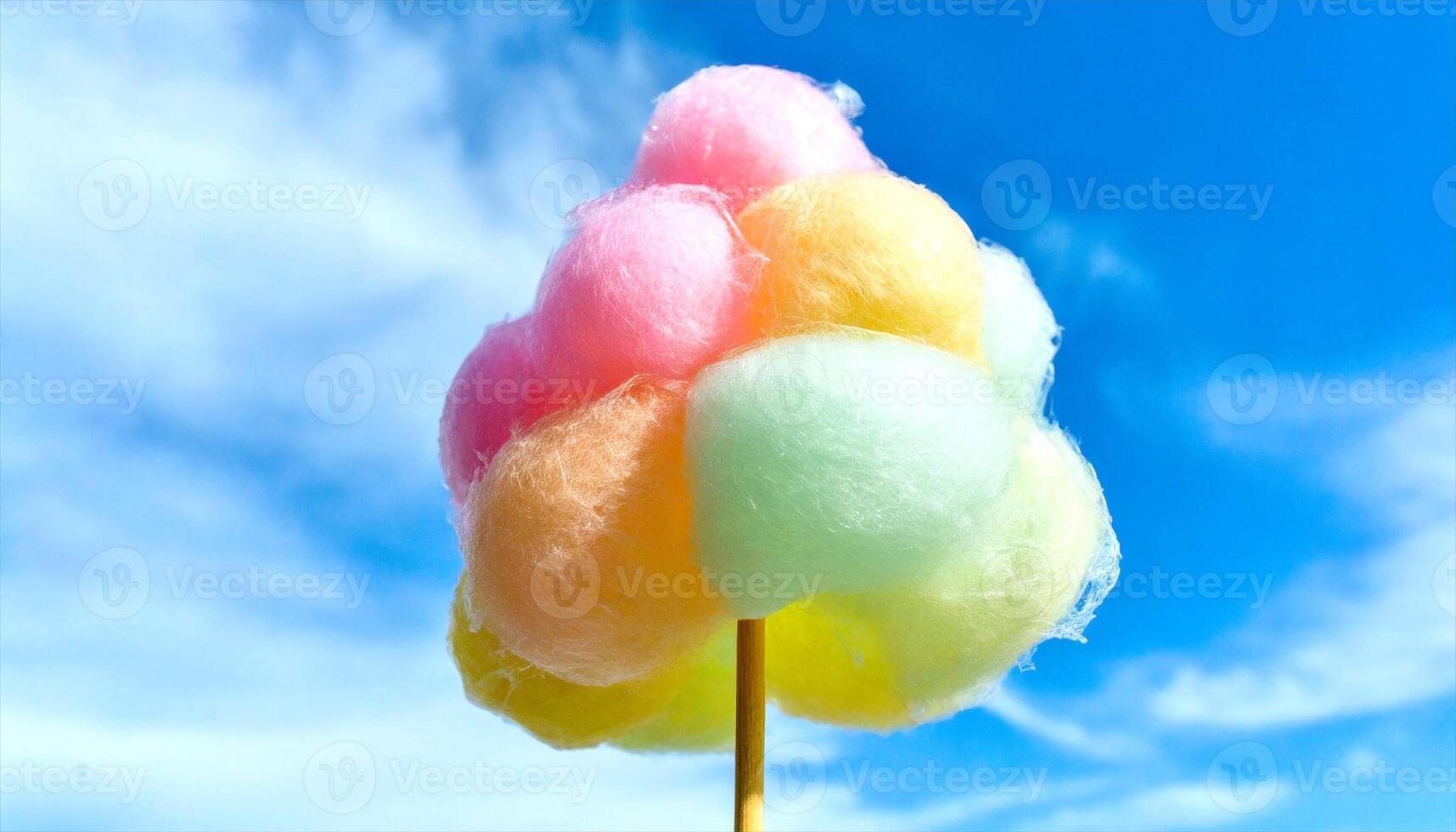 AI generated a cotton candy on a stick with a blue sky in the background photo
