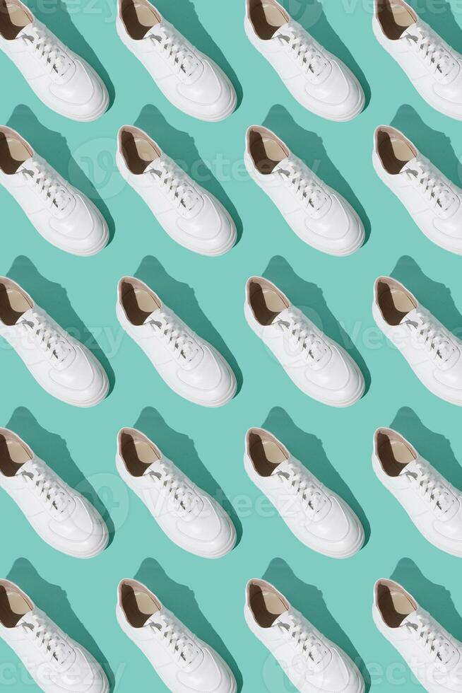 White sneakers pattern on background. The shoes are comfortable and casual. Background for a shoe store. photo