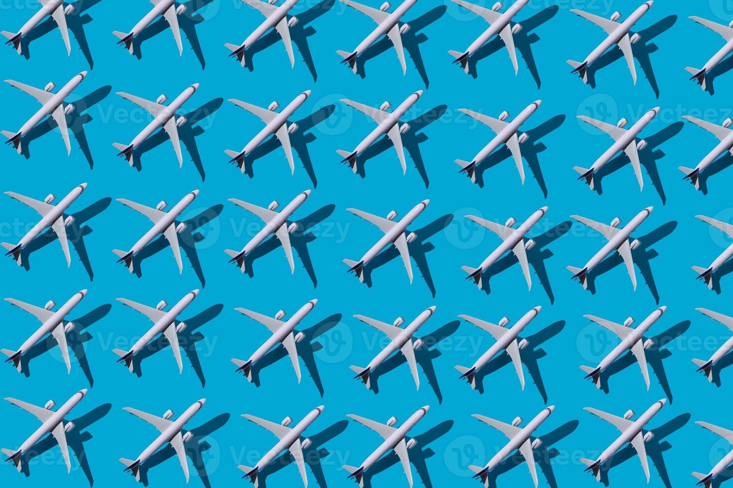 Christmas background. Christmas tree from planes. Postcard for airlines. An airport. Blue background with place for text Copy space. Pattern from planes on a blue background. Fly airline. Airplane photo