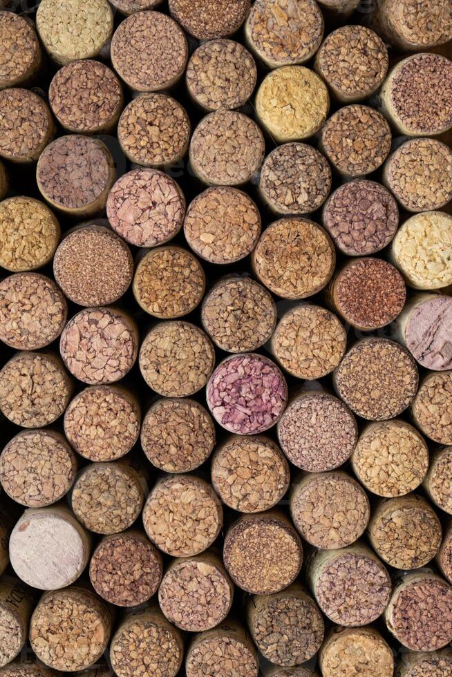 Wine background. Lots of bottle caps. Bark cork. Wine bottle corks photo