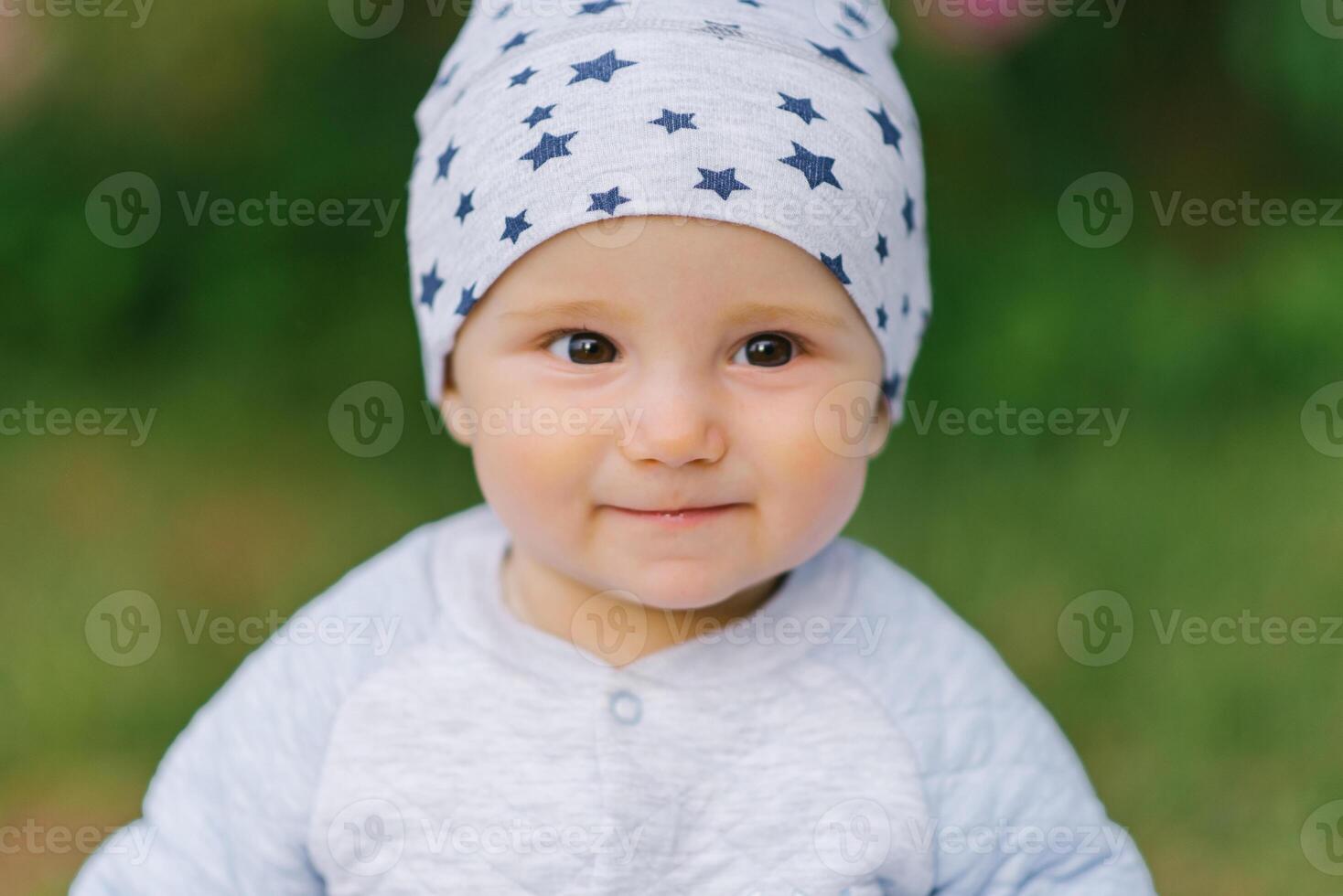 Portrait of an eight-month-old baby boy close-up face photo