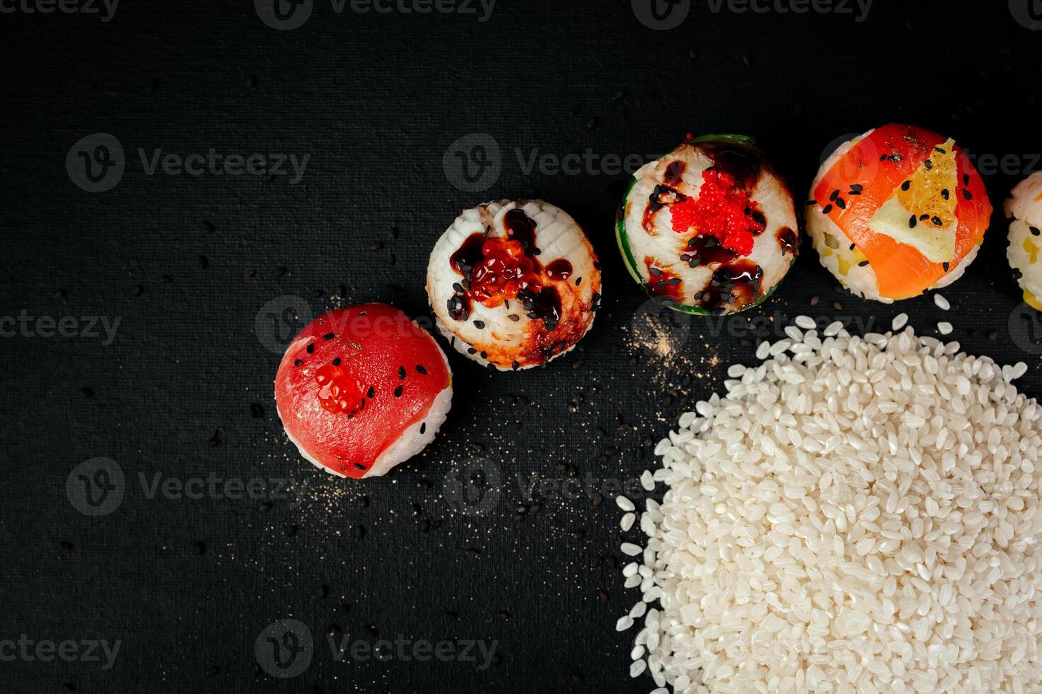 Sushi frame panorama, overhead flat lay shot. Rolls, maki, nigiri on a black slate background, Japanese food panoramic banner. Salmon, eel, shrimp, tuna with rice, with copy space. High quality photo