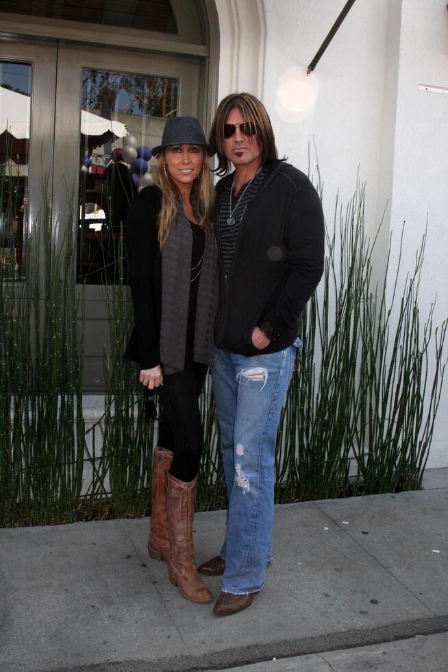 Tish  Billy Ray Cyrus arriving at the 7th Annual John Varvatos Stuart House Benefit at the John Varvatos Store in West Hollywood, CA  on March 8, 2009 photo