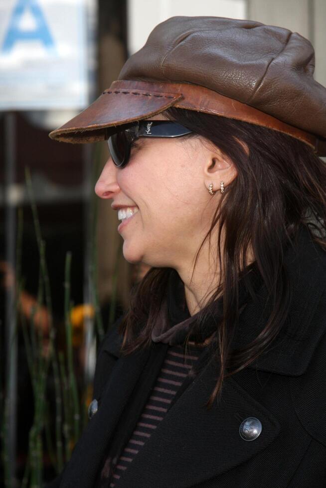 Gina Gershon  arriving at the 7th Annual John Varvatos Stuart House Benefit at the John Varvatos Store in West Hollywood, CA  on March 8, 2009 photo