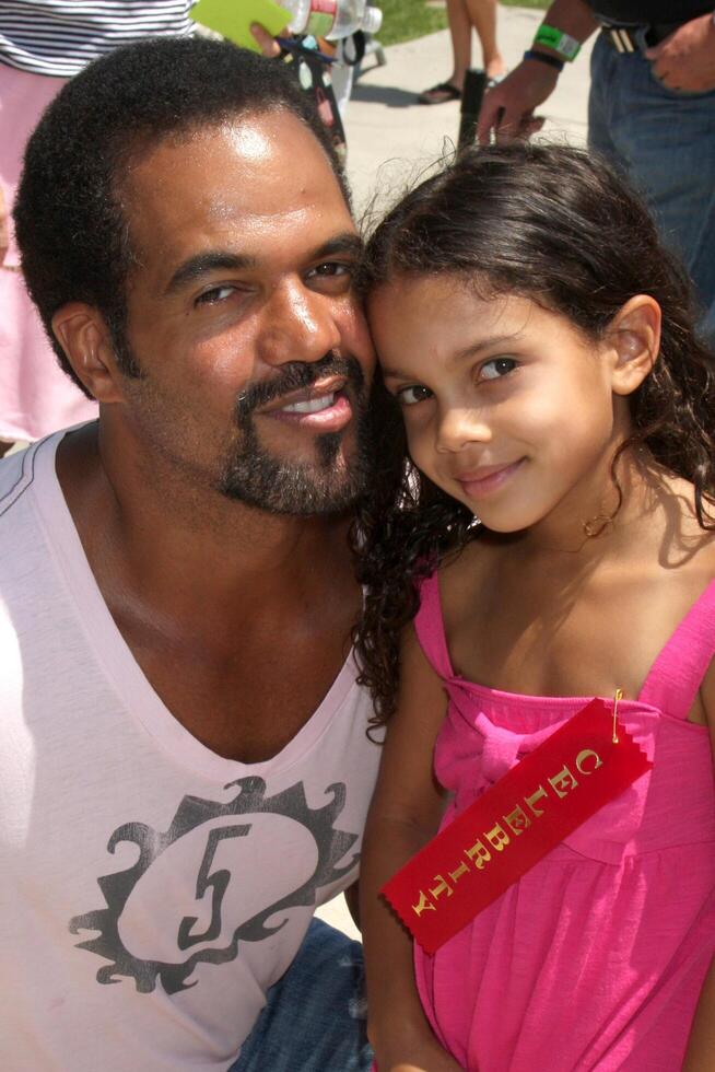 Kristoff St. John  Daughter Lola  at the Celebrity Miniature Golf Tourament at Boomer's in Irvine, CA,  on  July 26, 2009 photo