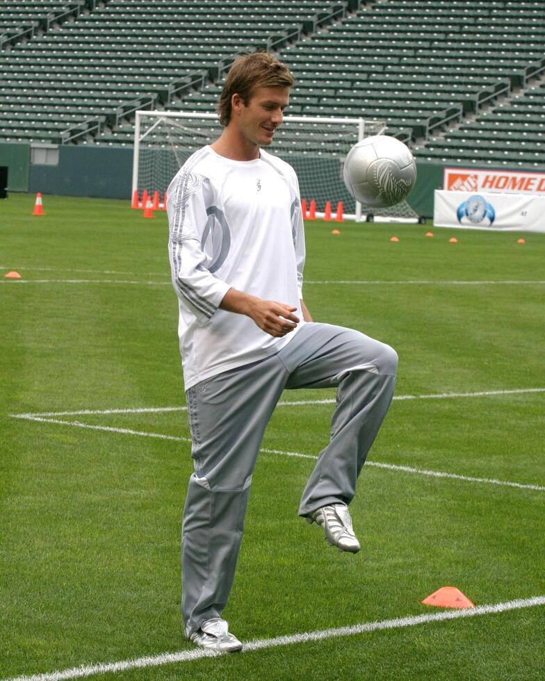 David Beckham demonstrates soccer skills for children after press conference to announce Soccer Academy beginning in Fall 2005 at the Home Depot Center in So California. Carson, CA June 2, 2005 photo