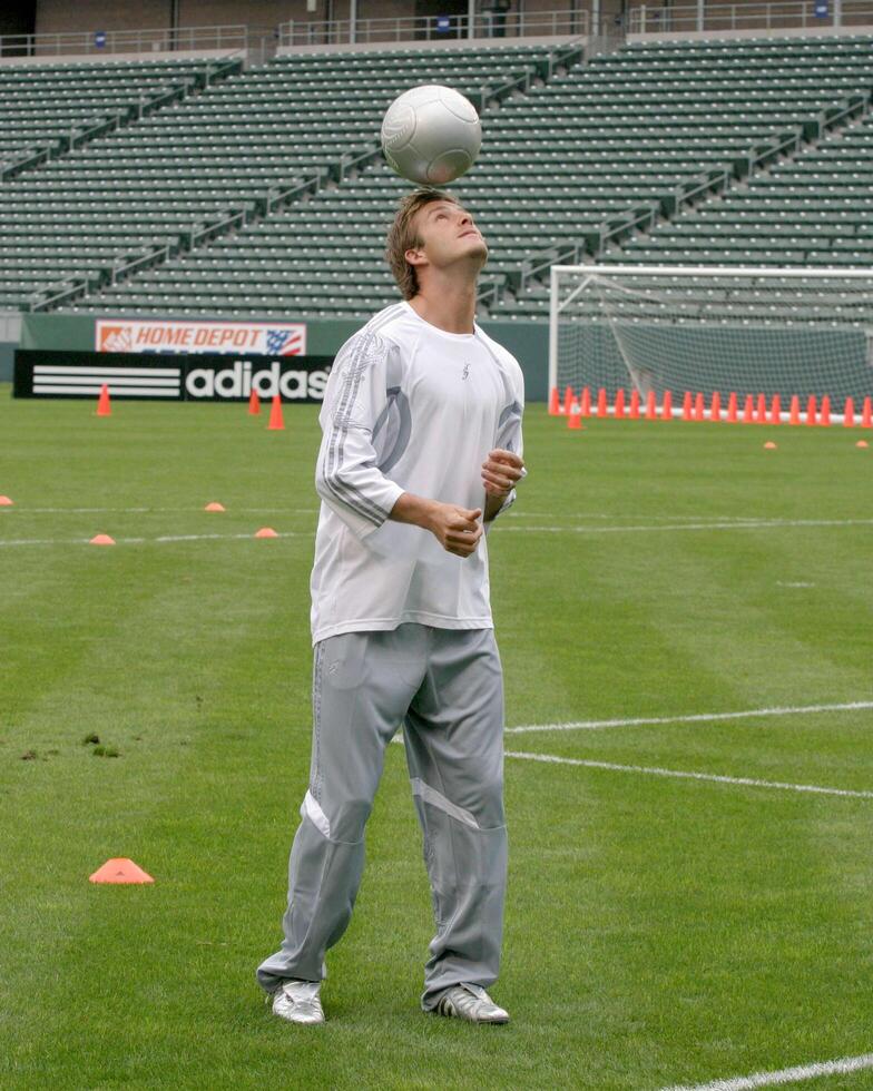 David Beckham demonstrates soccer skills for children after press conference to announce Soccer Academy beginning in Fall 2005 at the Home Depot Center in So California. Carson, CA June 2, 2005 photo