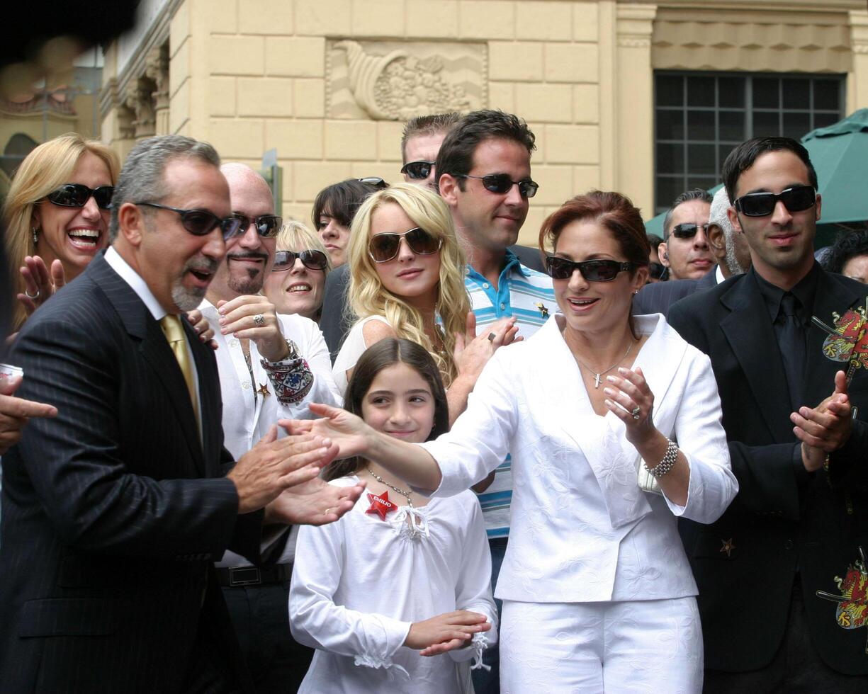 Emilio Estefan and wife Gloria, daughter and son Lindsay Lohan Emilio Estefan Star on the  Hollywood Walk of Fame Los Angeles, CA June 9, 2005 photo