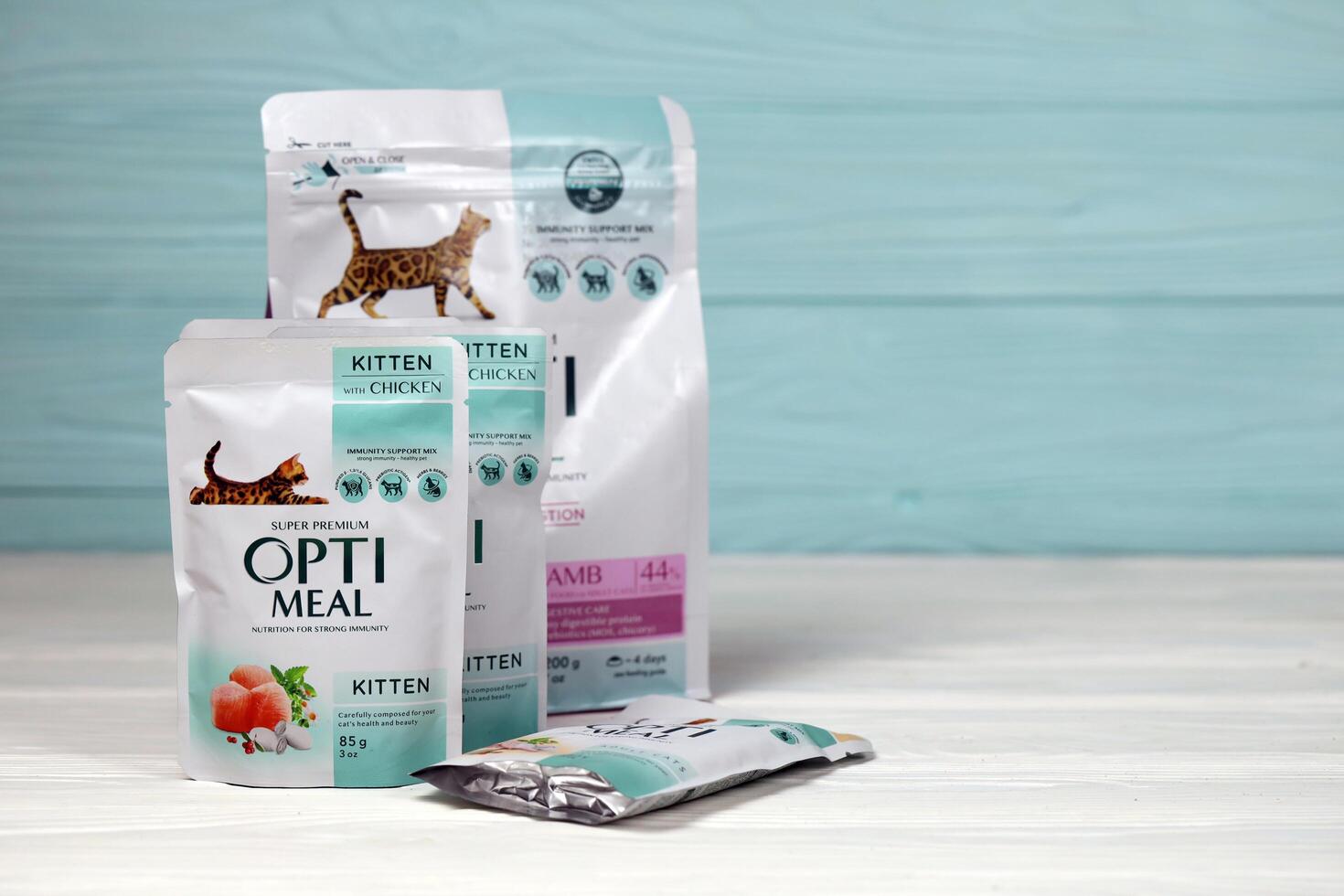 KHARKIV, UKRAINE - JANUARY 2, 2021 Optimeal cat meal packs. Optimeal is product by Kormotech LLC, a global family company, the largest producer of pet food in Ukraine photo