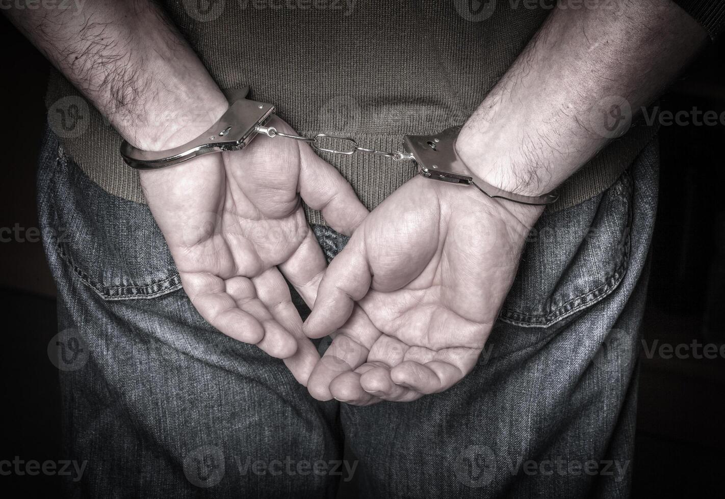 man hands in handcuffs photo