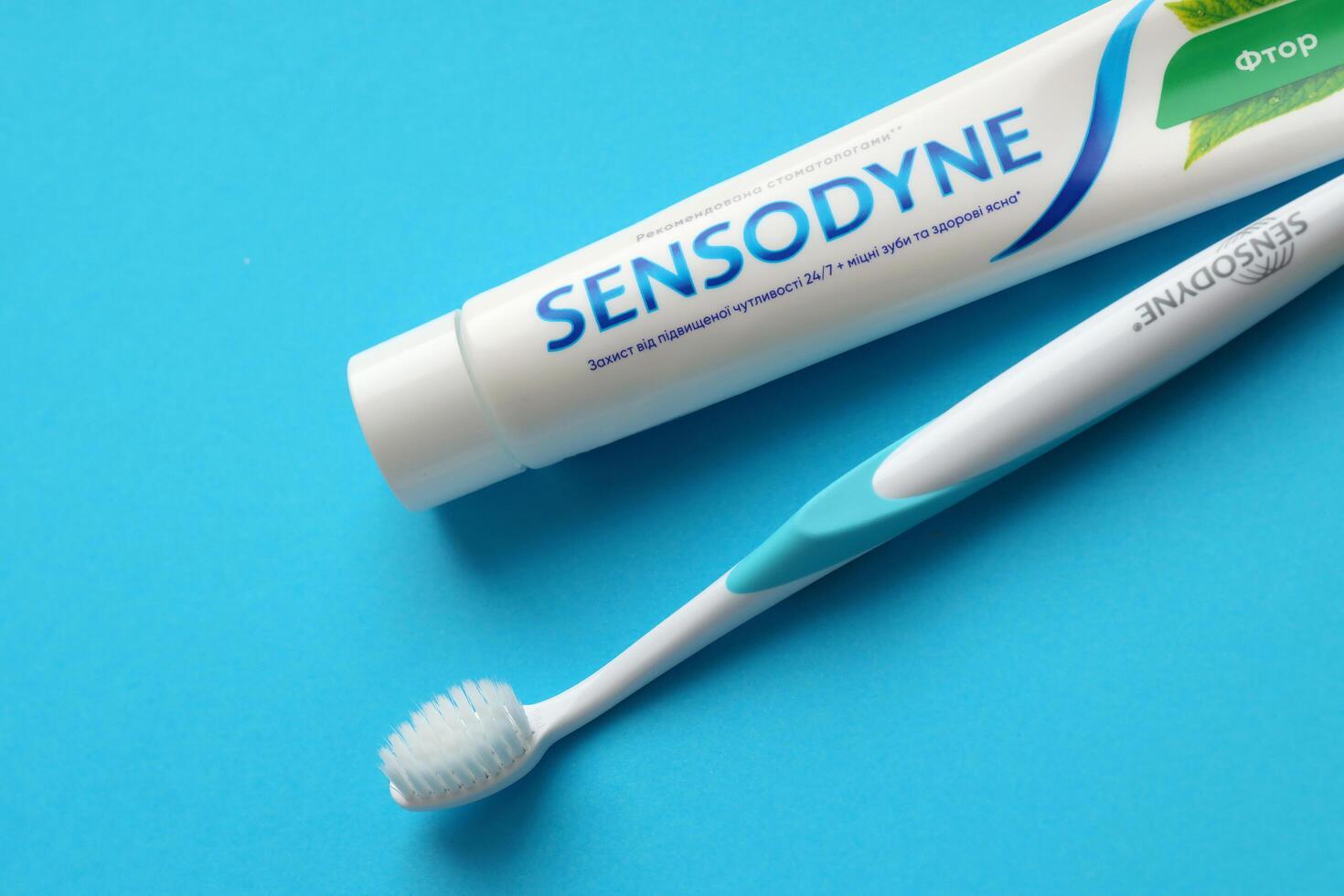 KYIV, UKRAINE - MAY 4, 2022 Sensodyne fluorine or fluor is a daily fluoride toothpaste photo