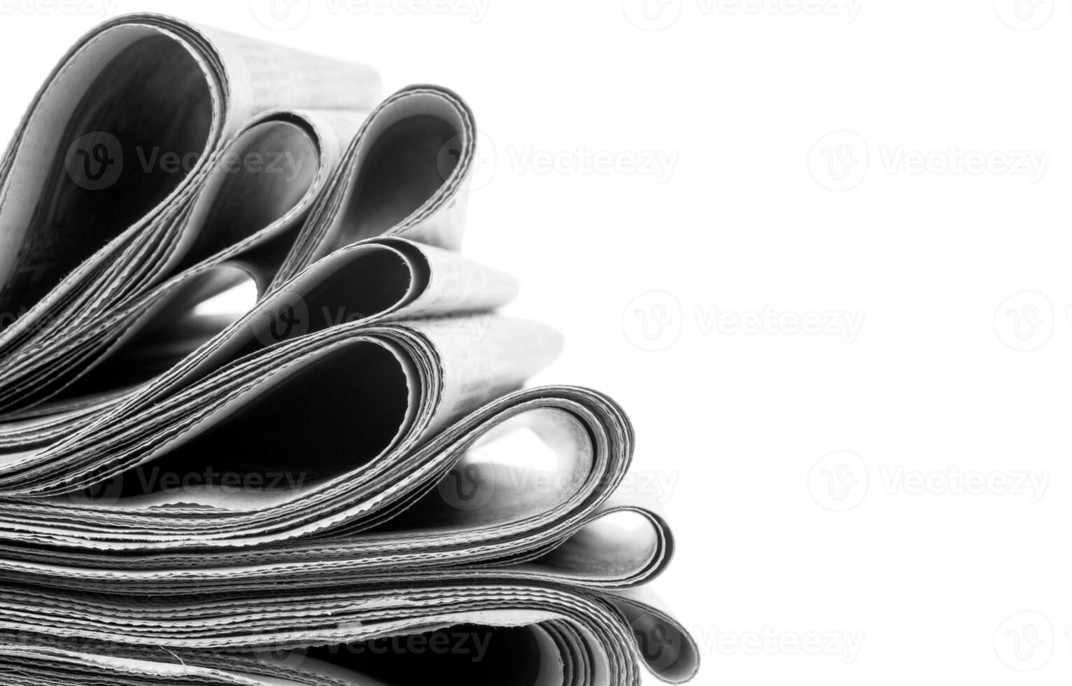 Newspapers folded and stacked photo