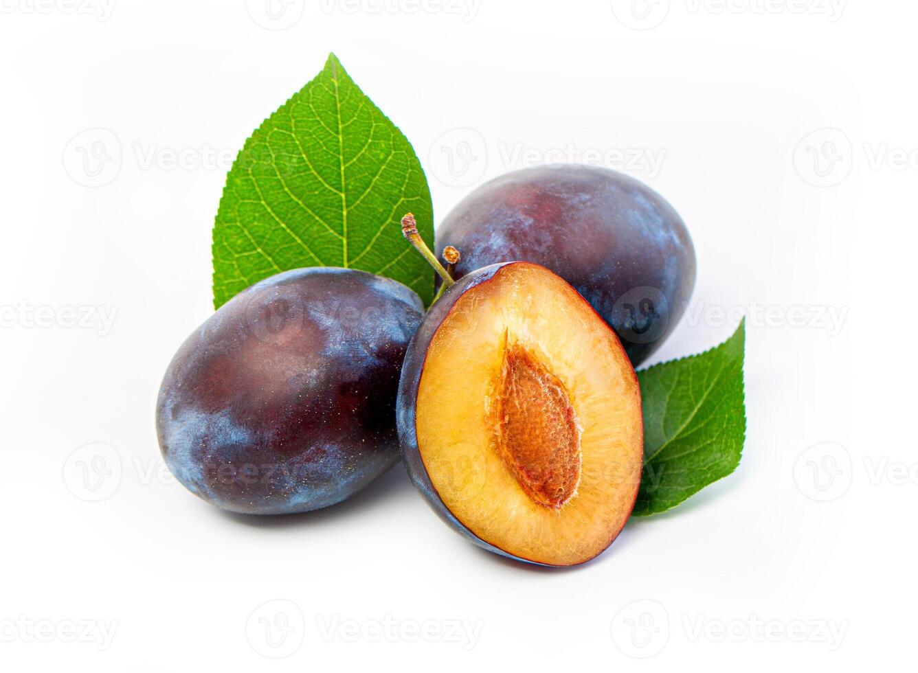 fresh plum fruits with green leaf photo