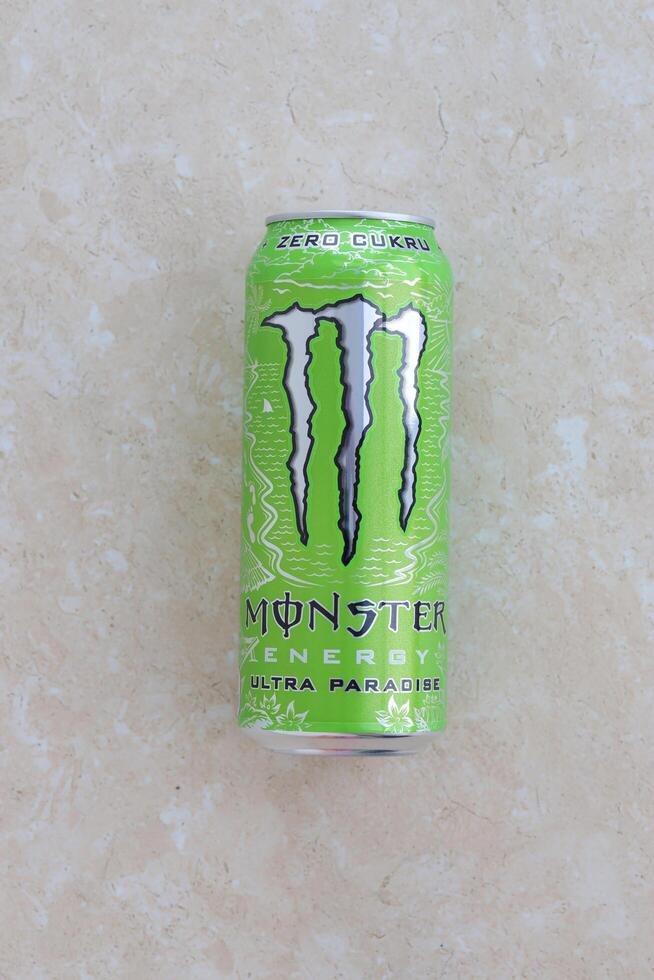 KYIV, UKRAINE - 4 MAY, 2023 Monster energy drink ultra paradise in green tin can with Monster energy drink logo photo