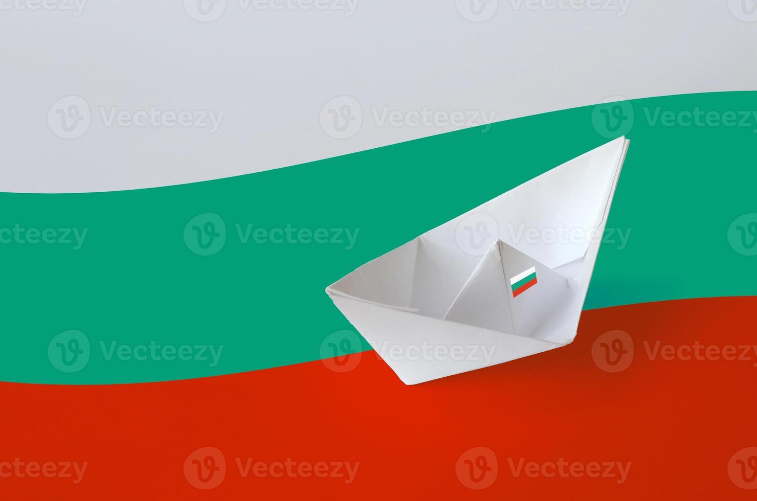 Bulgaria flag depicted on paper origami ship closeup. Handmade arts concept photo