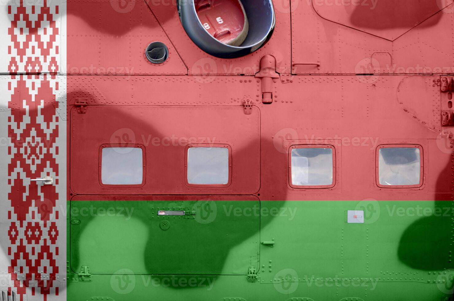 Belarus flag depicted on side part of military armored helicopter closeup. Army forces aircraft conceptual background photo