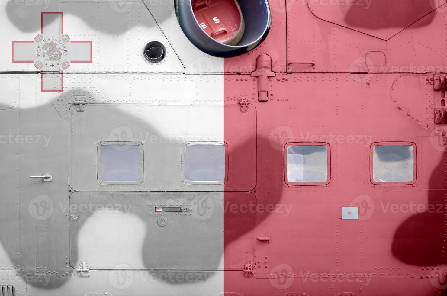 Malta flag depicted on side part of military armored helicopter closeup. Army forces aircraft conceptual background photo