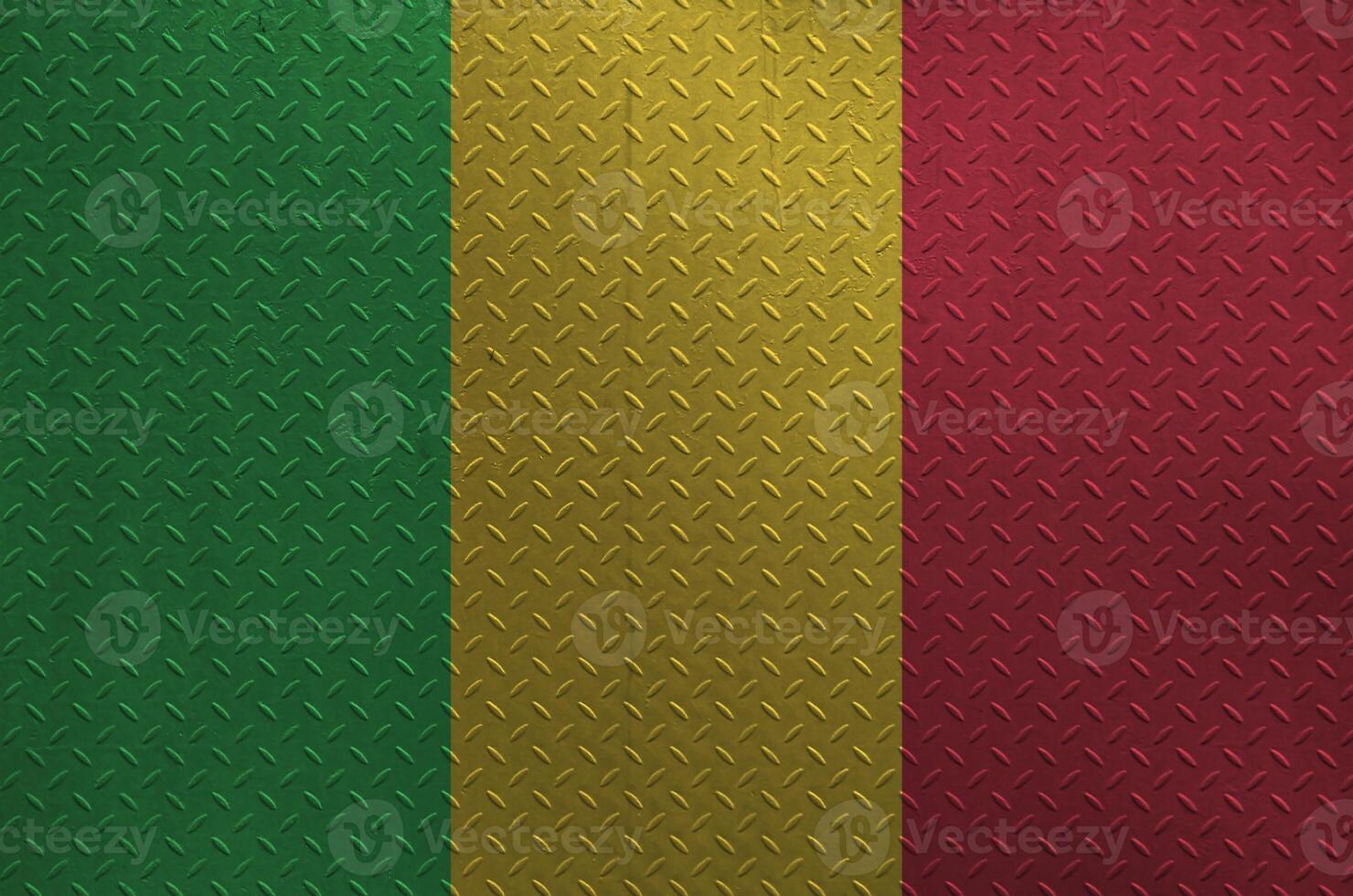 Mali flag depicted in paint colors on old brushed metal plate or wall closeup. Textured banner on rough background photo