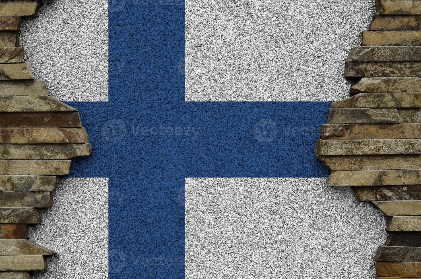 Finland flag depicted in paint colors on old stone wall closeup. Textured banner on rock wall background photo