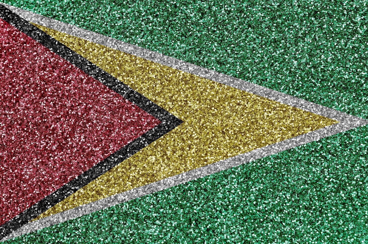 Guyana flag depicted on many small shiny sequins. Colorful festival background for party photo