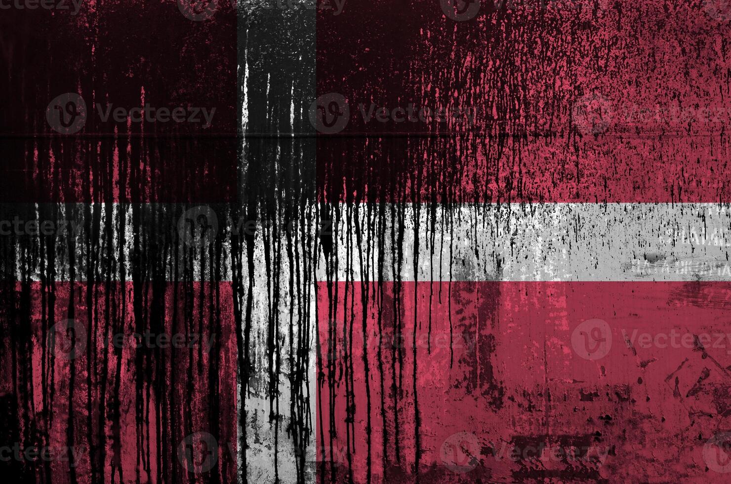 Denmark flag depicted in paint colors on old and dirty oil barrel wall closeup. Textured banner on rough background photo